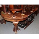 A late 19th century/early 20th mahogany wind-out dining table. 75cm high by 137cm wide, 238cm long