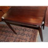 A George III mahogany fold over tea table