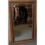 A Gilt Bevelled Glass Rectangular Mirror, with floral and green bordered frame, 136cm by 81cm