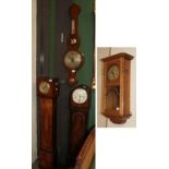 Two small chiming Art Deco longcase clocks and a wheel barometer and an oak cased chiming wall