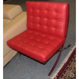 ^ A Barcelona Style Lounge Chair, modern, covered in red buttoned leather, 75cm by 76cm by 76cm