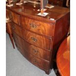 ^ A Regency mahogany and cross-banded five drawer bow fronted chest of drawers, 100cm wide