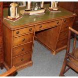 A Gillows satin birch double pedestal desk inset with green leather top, 129cm diameter