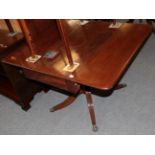 ^ A Regency mahogany drop leaf sofa table on reeded legs, 91cm wide