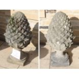 A pair of large weathered composition artichoke finials (a.f.)