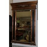 A Gilt Bevel Glass Mirror, the rectangular frame surrounded by reeded pilasters, the base with a egg