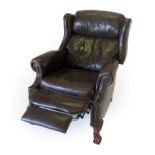 A Brown Leather and Close-Nailed Reclining Armchair, modern, with rounded arms above a pivoting