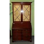 A George III style mahogany secretaire bookcase