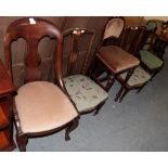 ^ A pair of inlaid rosewood nursing chairs with green floral needlework seats; a late Victorian