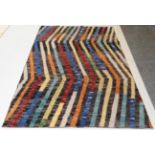 Modernist Indian Hand-Knotted Rug, the field comprised of polychrome zigzag bands, 231cm by 140cm.
