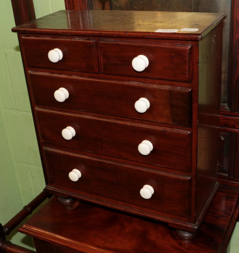 ^ A Victorian mahogany miniature five drawer straight fronted chest of drawers, 40cm wide