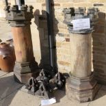 A pair of castellated chimney pots