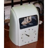 A 1930s light green bakelite cased Vitascope clock with ship automata