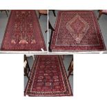 ^ Baluch rug, the field of serrated leaves and guls enclosed by multiple borders, 218cm by 122cm;