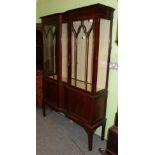 An early 20th century mahogany double door display cabinet