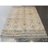 Modern Moroccan Hand-Knotted Rug, the ivory field with five columns of linked diamond medallions,