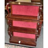 A 19th century rosewood waterfall bookcase with scroll supports