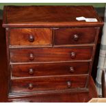 A 19th century mahogany miniature four height chest of drawers