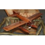 A Mahogany Model In The Form Of A 1930's Aeroplane, with pivoting propeller, the wings joined by