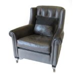 Duresta: A Wing-Back Chair, modern, covered in Aston Grey leather, with buttoned back, rounded arm