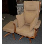 An Ercol Ash Framed Swivel Armchair, circa 2005, design no.1081H, upholstered in cream fabric,