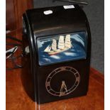 A 1930s black bakelite cased Vitascope clock with ship automata