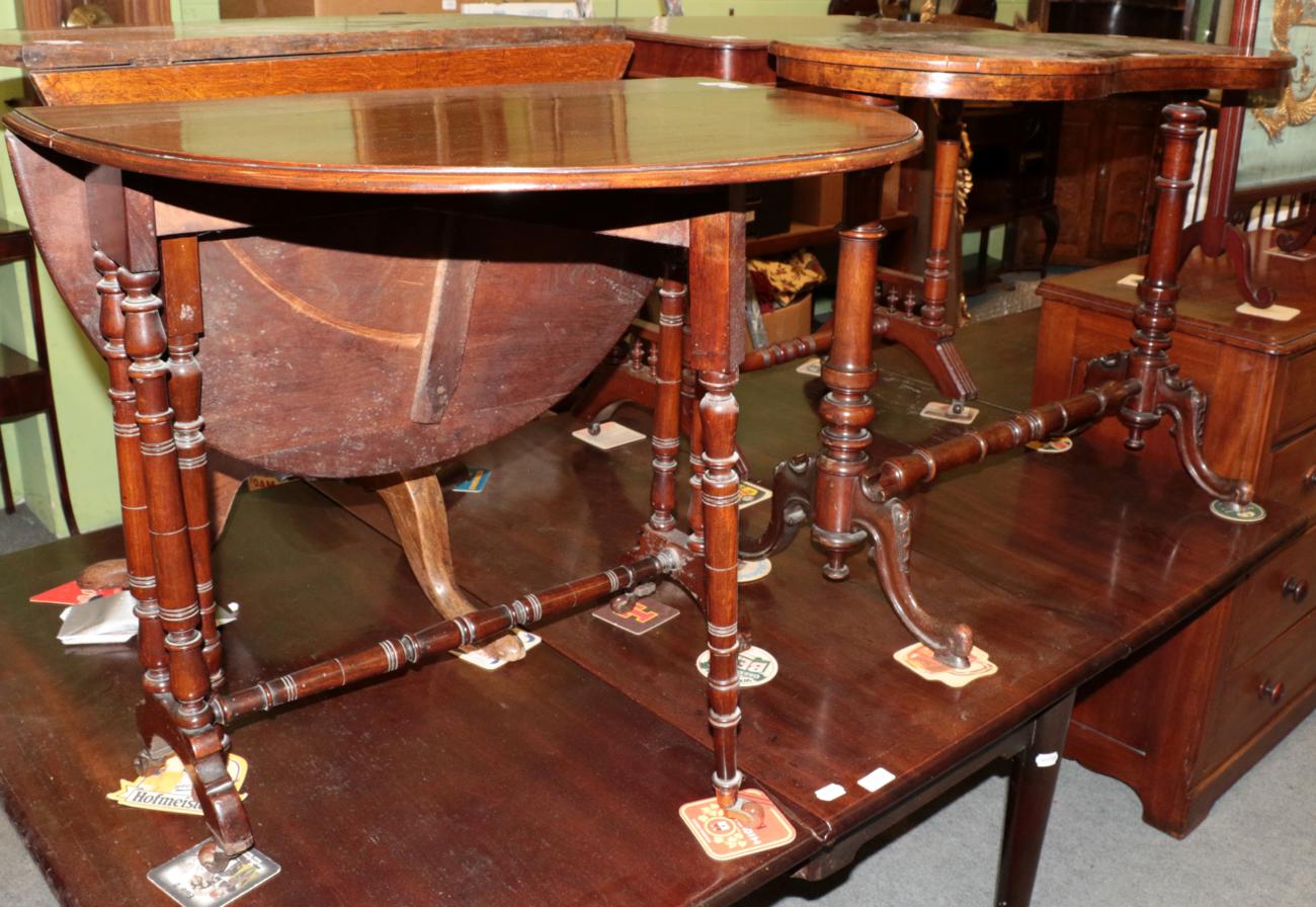 ^ A Victorian walnut kidney shaped occasional table with leather top, 91cm wide; and a Victorian