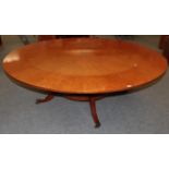 A Reproduction Burr Maple Extending Dining Table, of circular form, with five additional leaves,