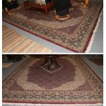 Pair of machine made carpets of Agra design, each with an aubergine field of herati design and