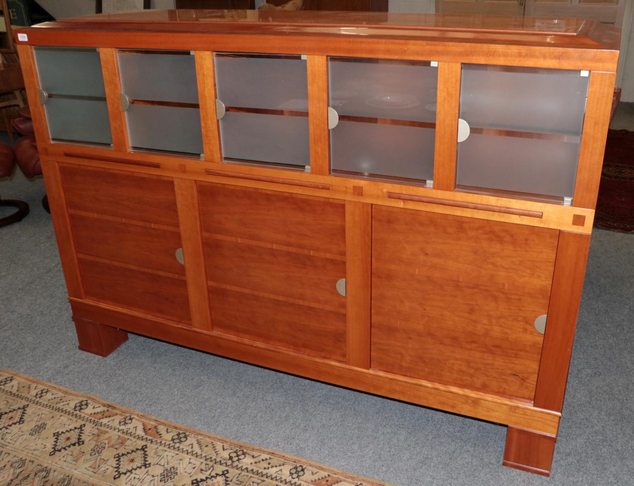 Leon Krier for Giorgetti: A Cherrywood Sideboard, with frosted glass doors and three cupboard