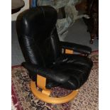 An Ekornes Stressless Lounge Reclining Armchair, in black leather, 84cm by 64cm by 96cm