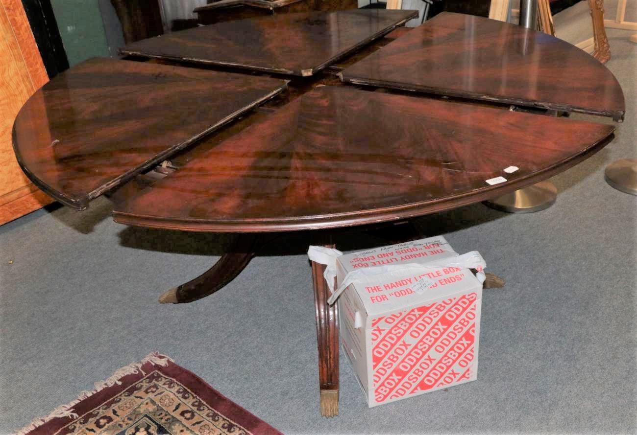 A Reproduction Jupe Style Dining Table, with pivoting and folding leaves, 186cm by 75cm