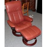 An Ekornes Stressless Swivel Armchair, modern, the stained beech frame with padded back support