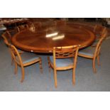 A Reproduction Mahogany Satinwood and Burr Wood Crossbanded Circular Dining Table, in the Regency