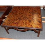 A Faux Tortoiseshell Painted Coffee Table, of square form with pierced apron, on square chamfered