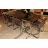 A 1970's Chromed and Glass Top Dining Table and Eight Chairs, including two carvers, the table of