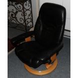 An Ekornes Stressless Reclining Lounge Armchair, in black leather, 70cm by 56cm by 96cm