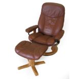 An Ekornes Stressless Swivel Lounge Chair, in tan leather, with padded arms and beech frame, 77cm by