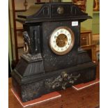 A Victorian black slate mantel clock