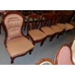 A Victorian mahogany framed nursing chair, a set of four Victorian dining chairs upholstered to