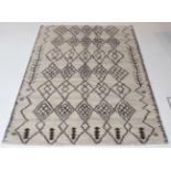 Modernist Morrocan Hand-Knotted Rug the abrashed natural field of stepped diamond lattice design