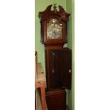 A eight day oak longcase clock, yew wood crossbanded door, arch brass dial, bearing a later