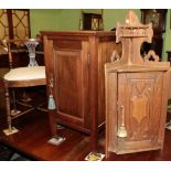 A small carved oak cupboard and mahogany beside cupboard