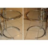 A Pair of Chromed Tubular Glass Top Circular Lamp Tables, modern, with adjustable height support,