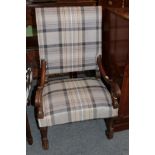 A 17th century walnut framed armchair recovered in tartan fabric with scrolled hand grips