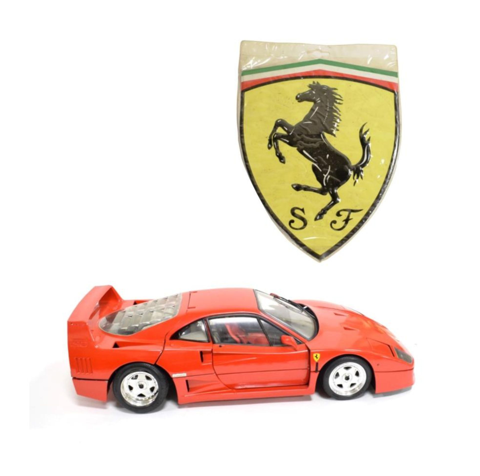 A Diecast Scale Model of a Ferrari F40, by Rivarossi, with pivoting wheels, hinged doors, bonnet and
