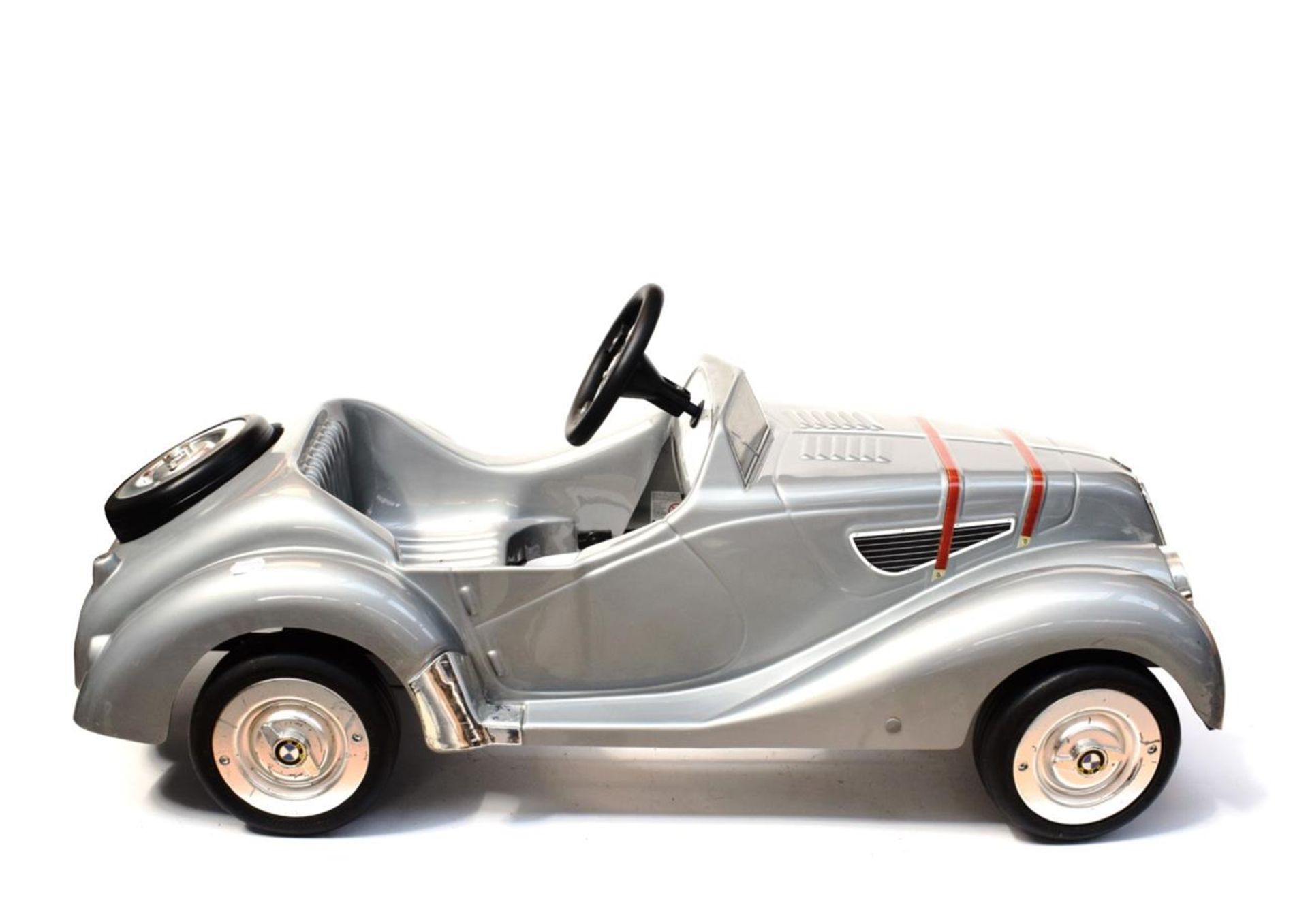 A Child's Grey Plastic Pedal Car, modern, modelled as a 1930's BMW328, with three-spoke steering