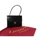 Launer Black Leather Small Handbag, with two tone metal fittings and circular clasp closure,