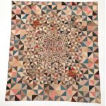 Circa 1800-20 Patchwork Quilt, comprising a design pieced together with triangles in four