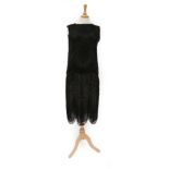 Circa 1920s Black Net Shift Dress, with black bugle bead decoration overall in scalloped design,